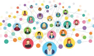 Ilustracja przedstawia sieć kontaktów, gdzie kolorowe kółka z ikonami ludzi łączą się liniami, symbolizując networking i relacje.