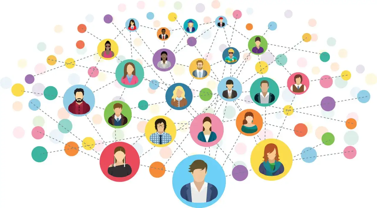 Ilustracja przedstawia sieć kontaktów, gdzie kolorowe kółka z ikonami ludzi łączą się liniami, symbolizując networking i relacje.