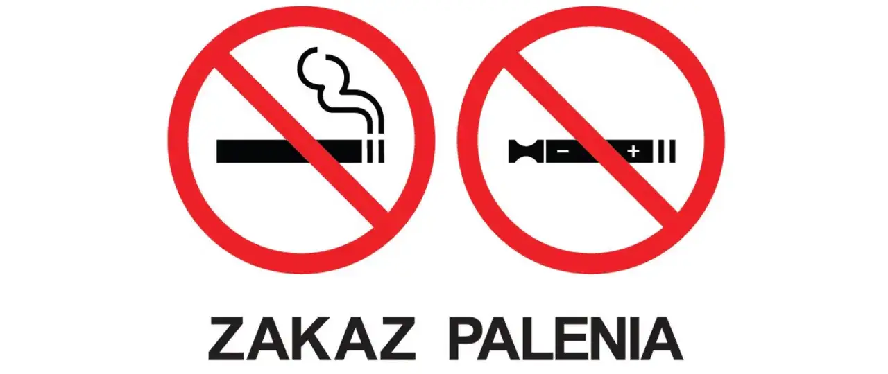 Dwa symbole przekreślone na czerwono: papieros z dymem i e-papieros. Pod nimi napis: ZAKAZ PALENIA.